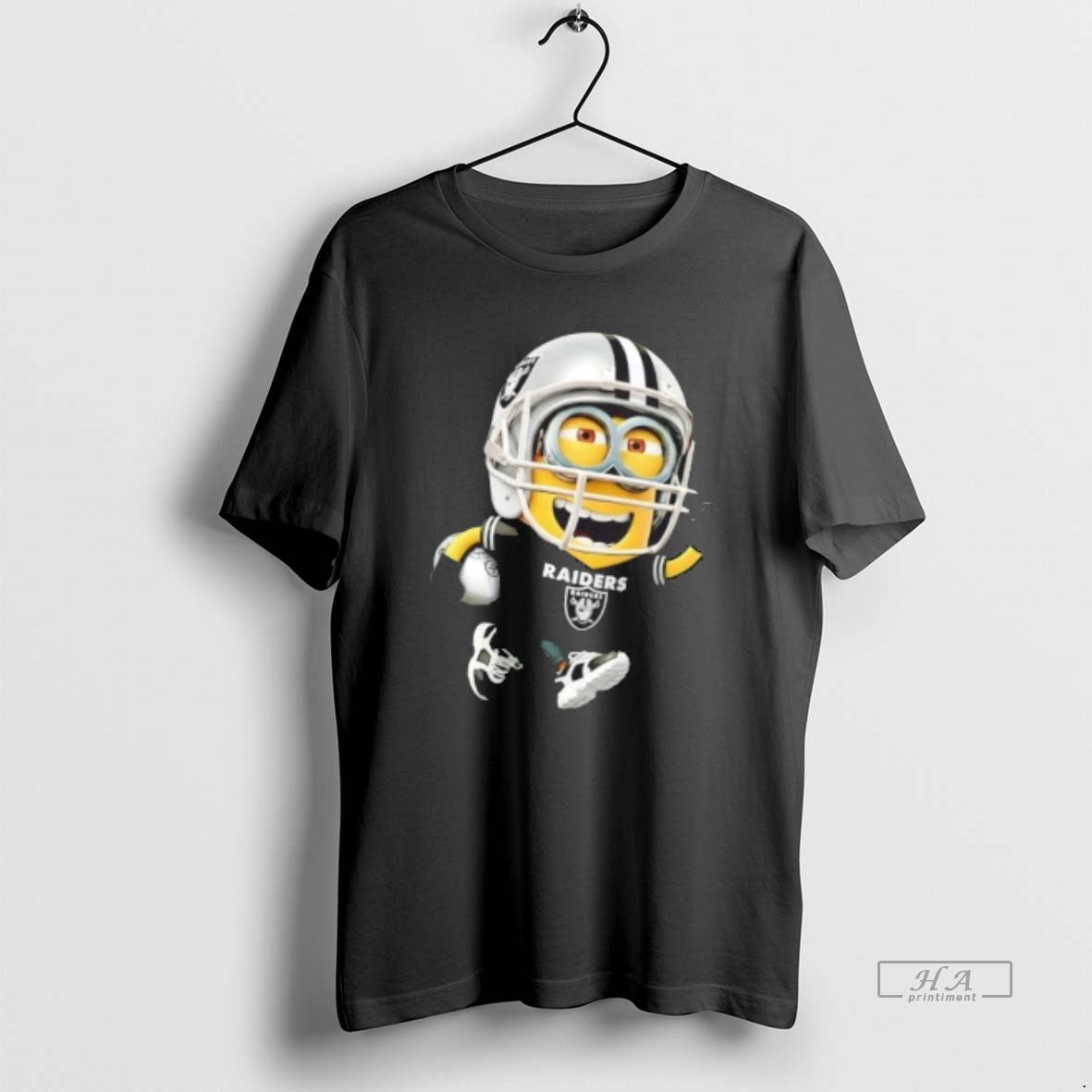 Trendy Minions Is Holding A Ball And Smiling At Oakland Raiders Fans Unisex , , , Long Sleeve Tee